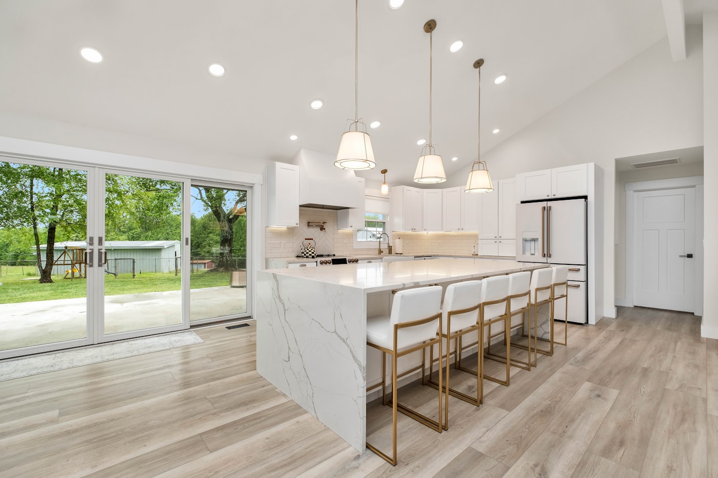Kitchen with center island and marble countertops